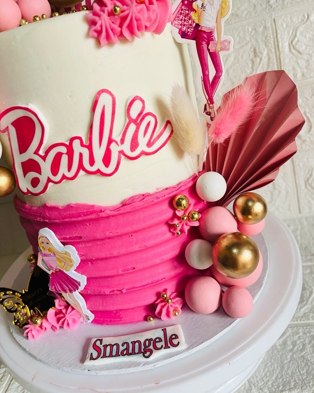 A pink Barbie-themed birthday cake