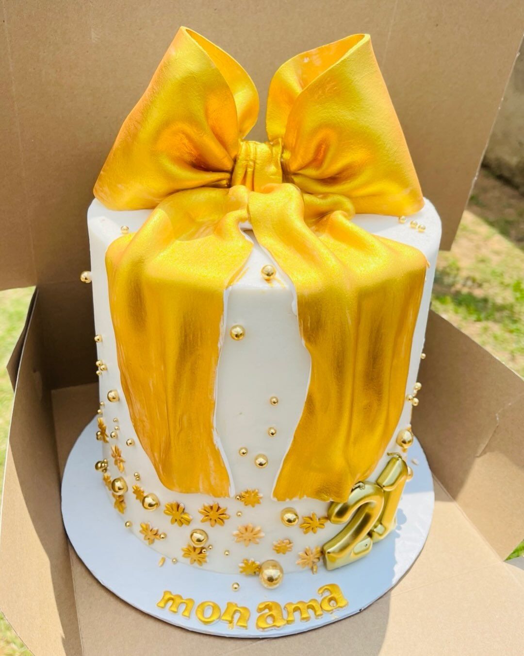 Golden Bow Cake by Baked by Buhlenkosi
